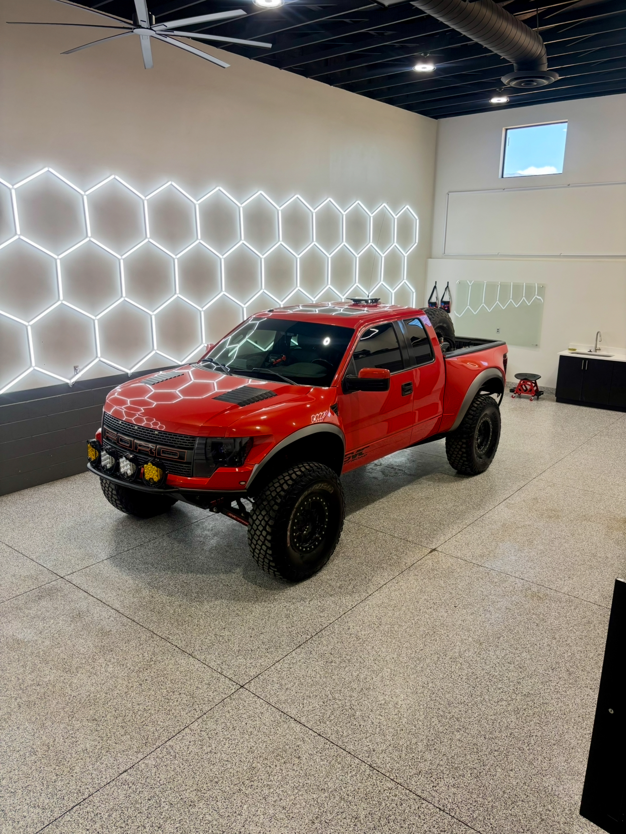 Ceramic coating application providing hydrophobic protection to vehicle paint
